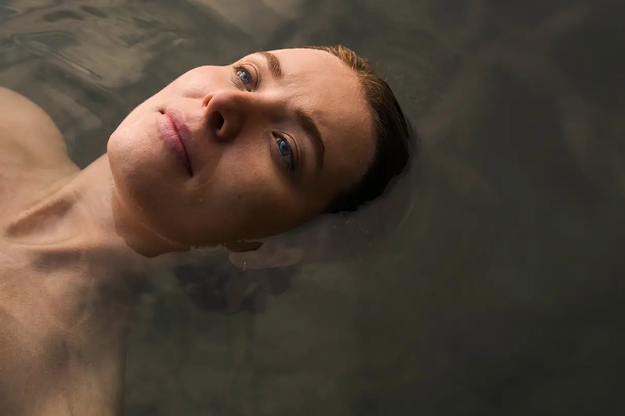 Woman laying in the water