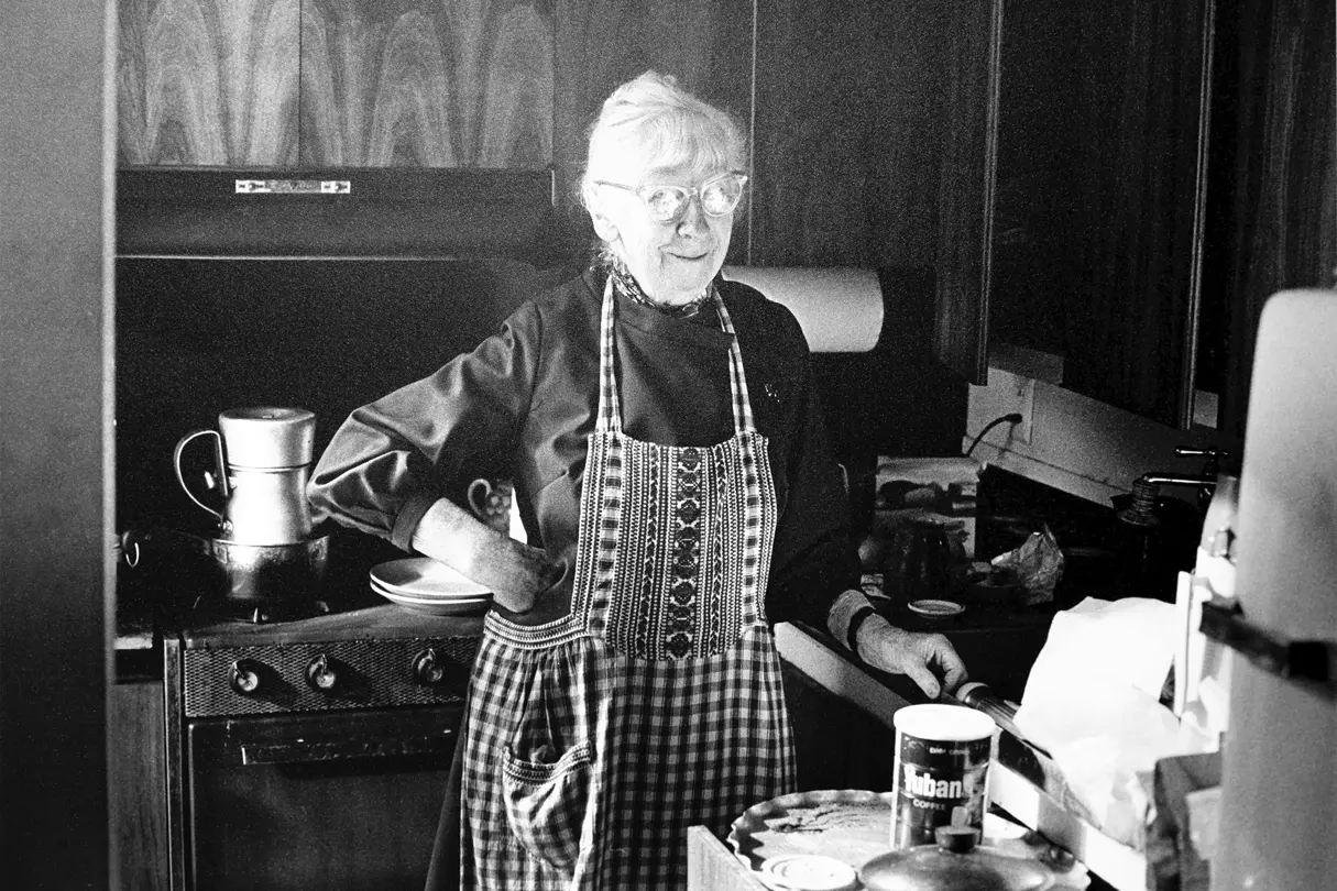 Old Woman Standing in her Kitchen