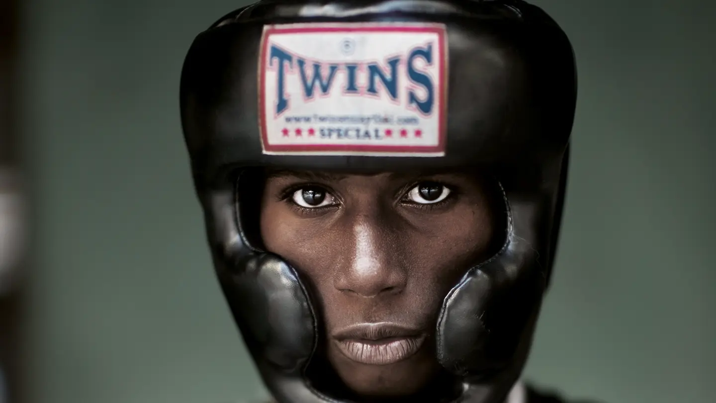 Portrait of a black boxer wearing a boxing helmet