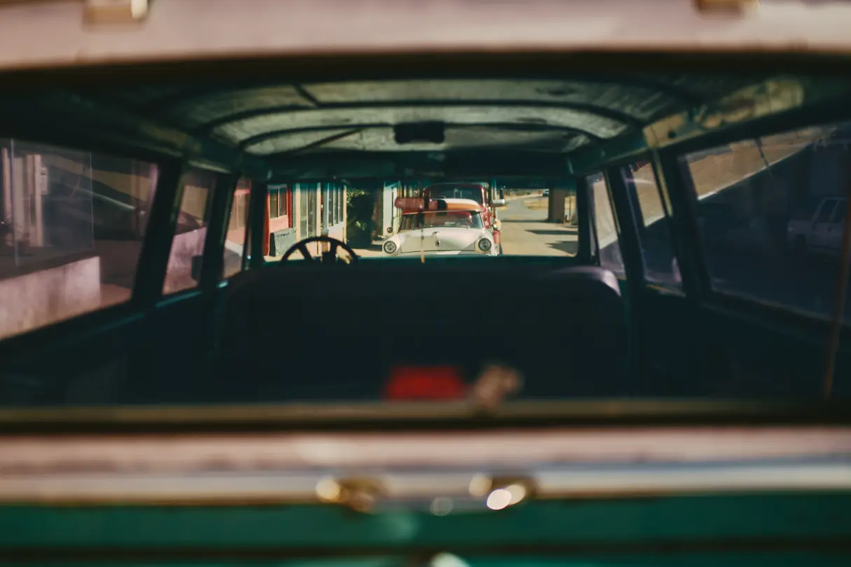 Car photographed through the windows of another car