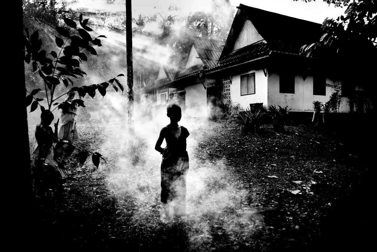 child running through mist