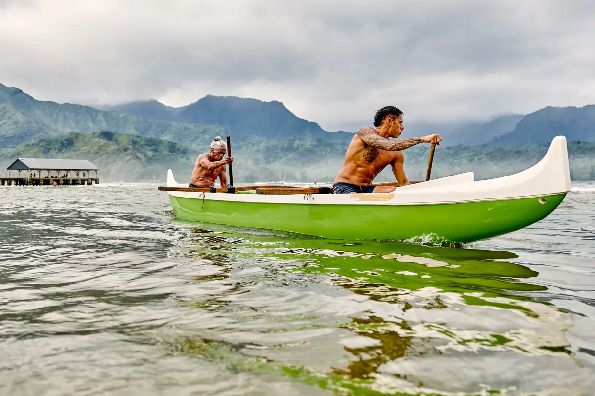An older man and a younger man in a kayak together