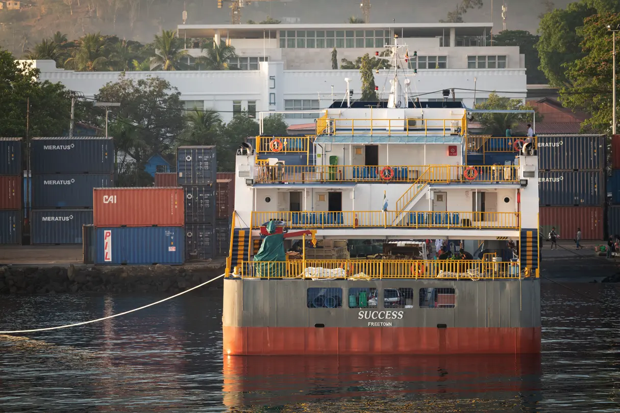 Ferry in the harbour; there are lots of containers on the quay