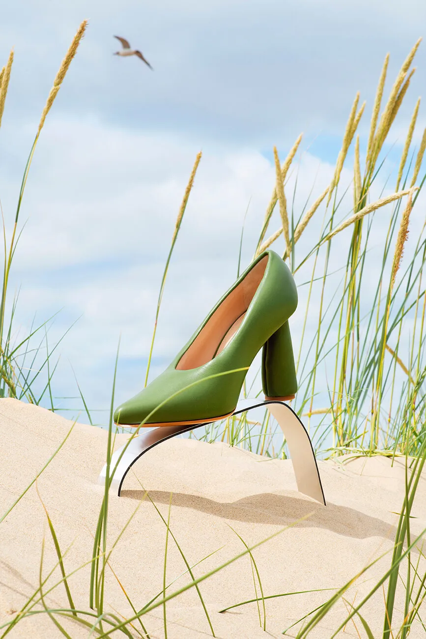 green high heel on the beach