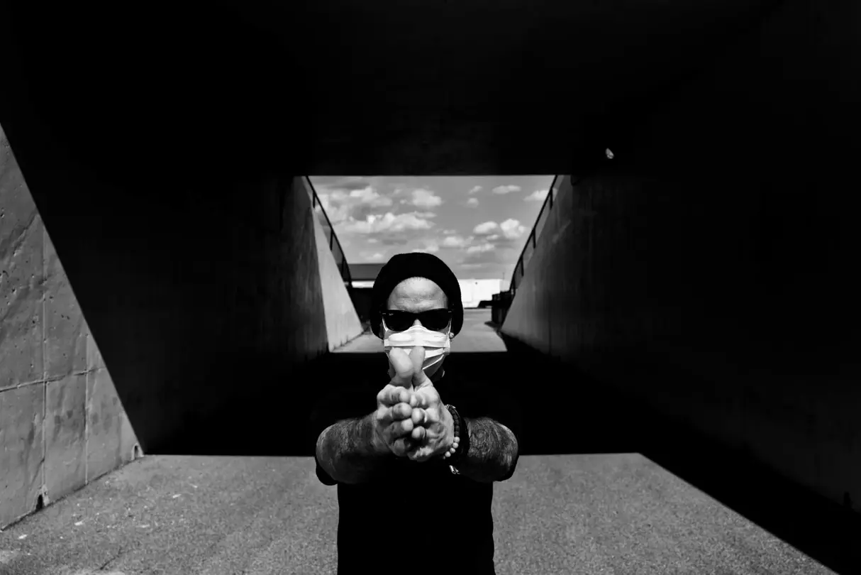 hand sign with mask b&w