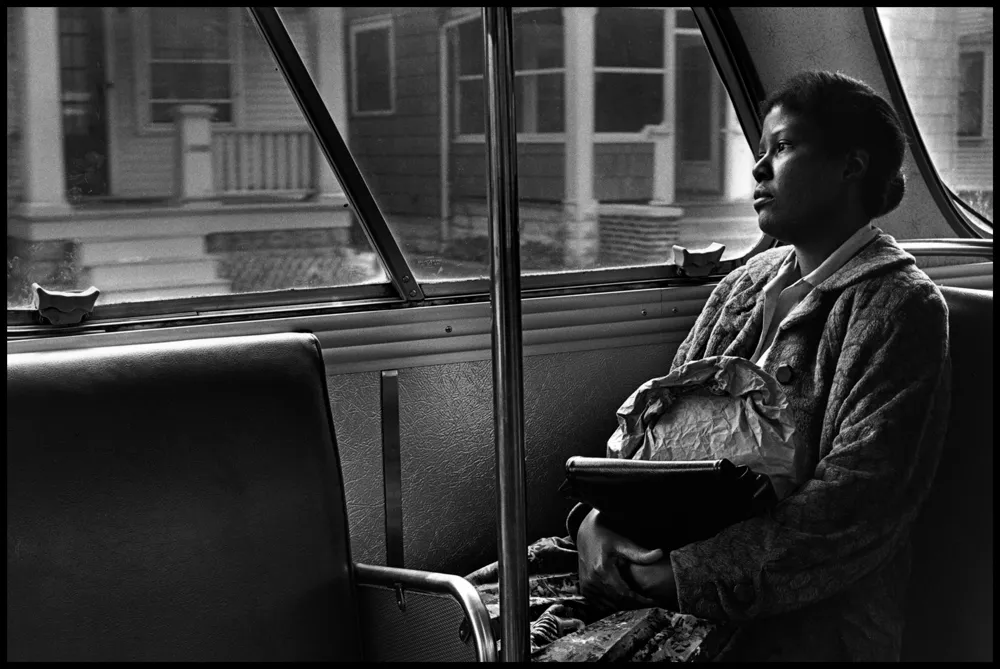woman sitting in bus b&w