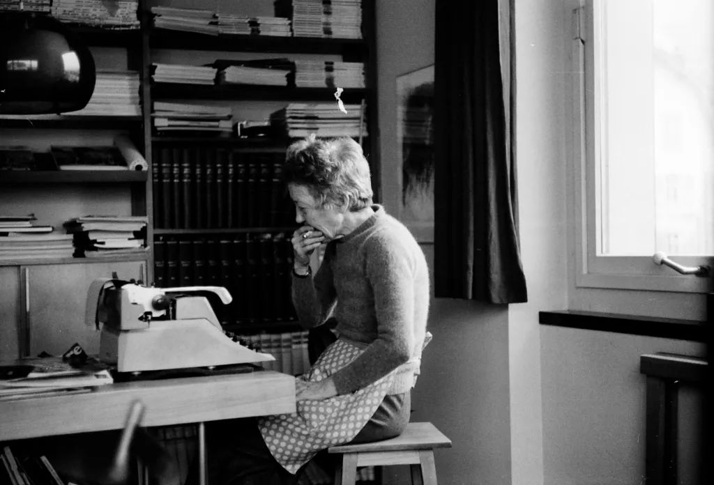 old woman eating apple b&w