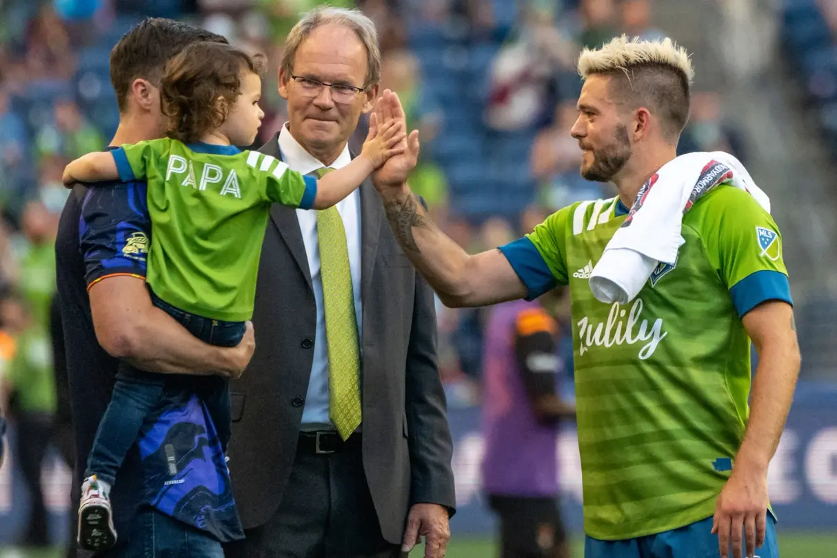 clapping hands with his son