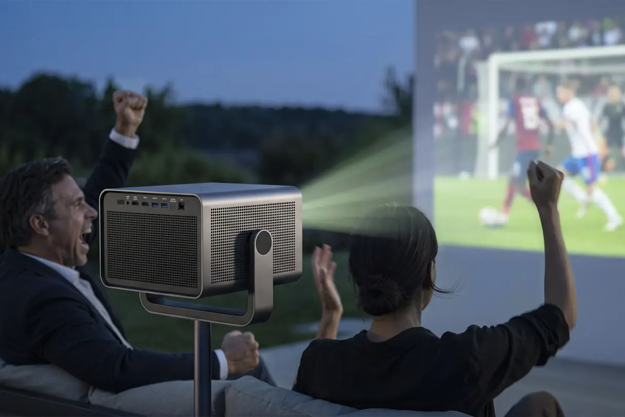 Cine Play 1 Couple watching soccer outside 