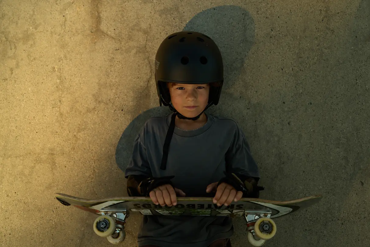 young boy with his skateboard