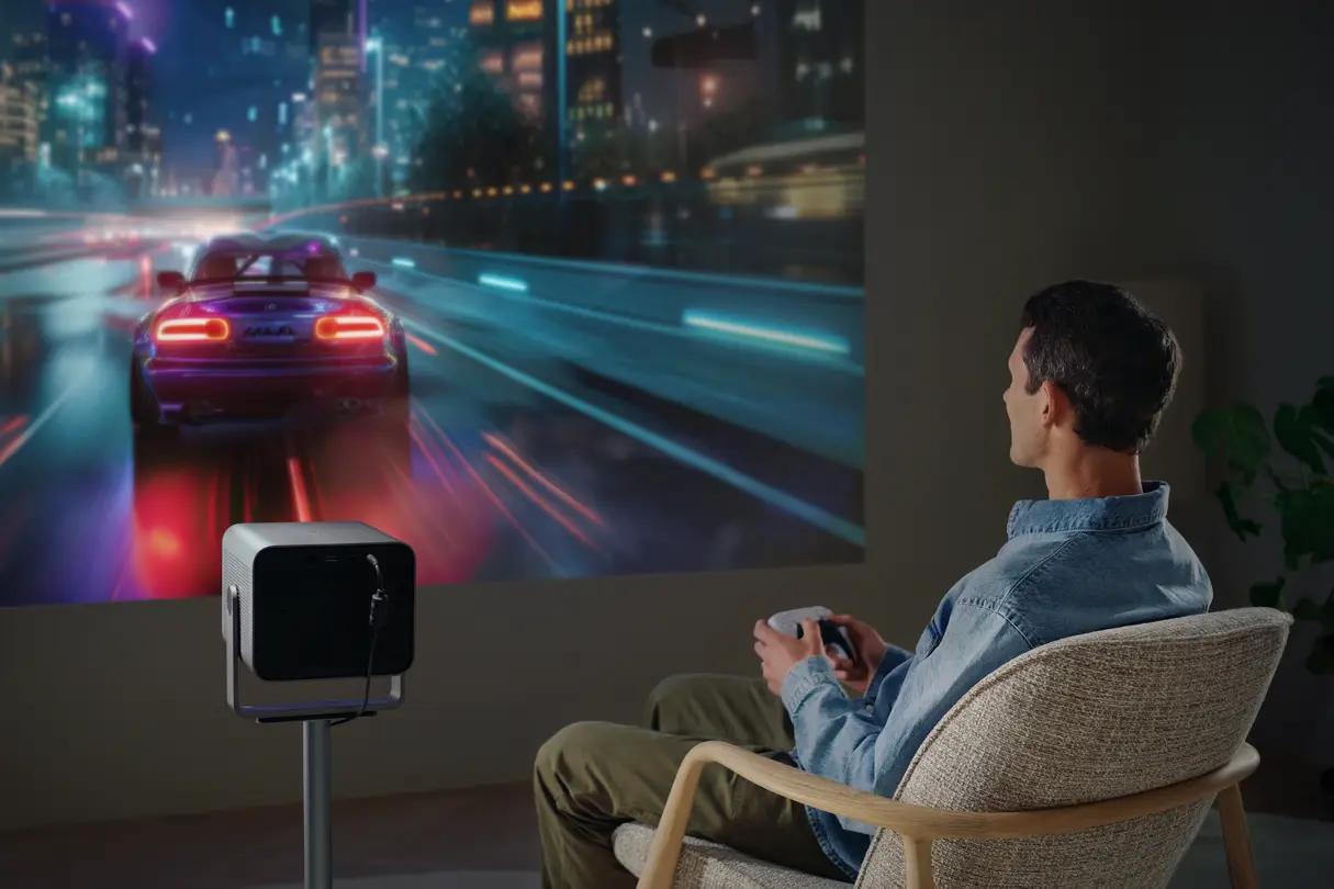 A man is playing games on the Cine Compact 1