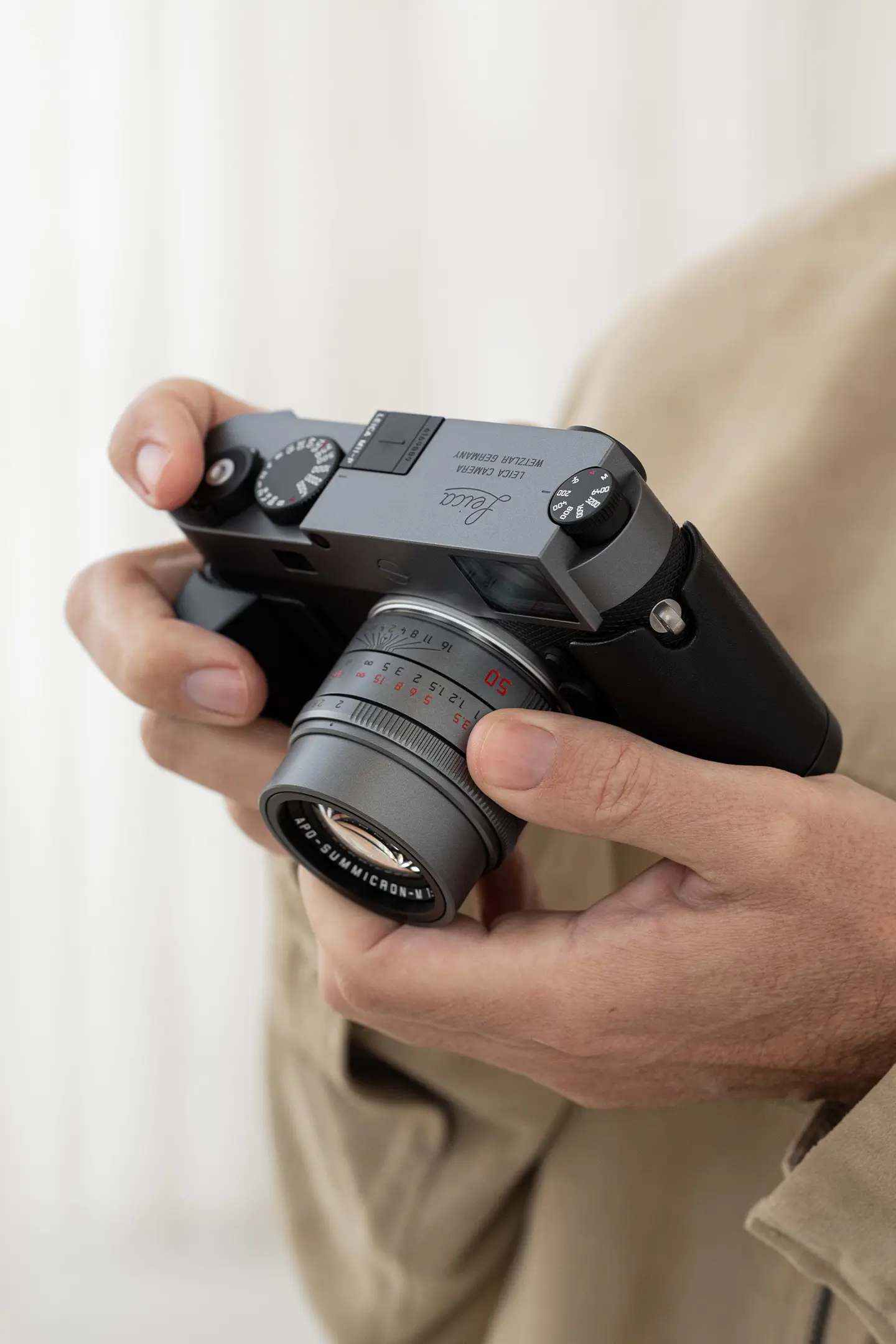 Leica M11-P Metal Gray with APO-Summicron-M 50 Metal Gray in hands