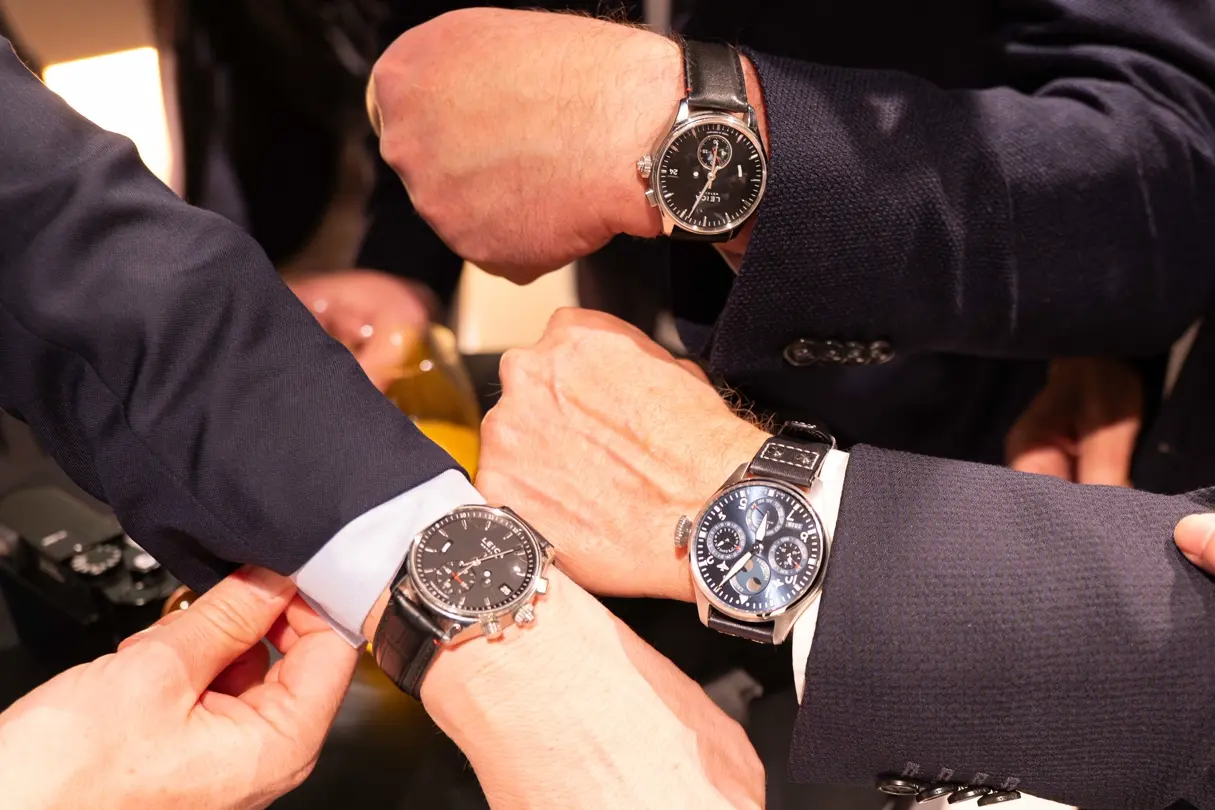 At the Leica Ginza 20th Anniversary Photo Exhibition Opening, watches displayed during a gathering moment