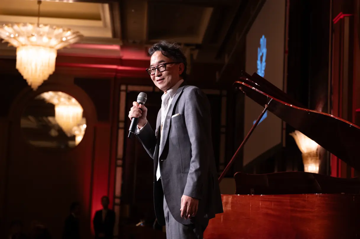 At the Leica Ginza Store Anniversary Dinner, stage speech moment during the program