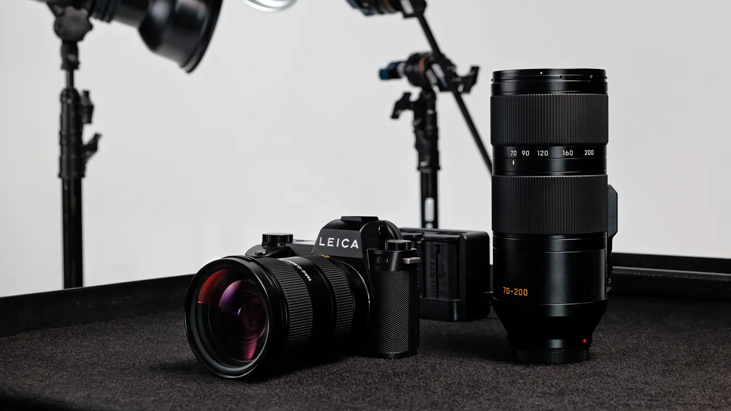 Leica SL3-P with Vario-Elmarit-SL 24-70 on a table next to the Vario-Elmarit-SL 70-200
