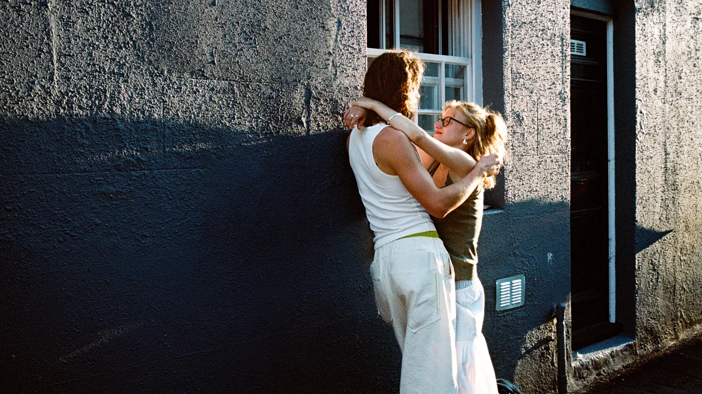 Colour image of a couple enjoying the sunset.