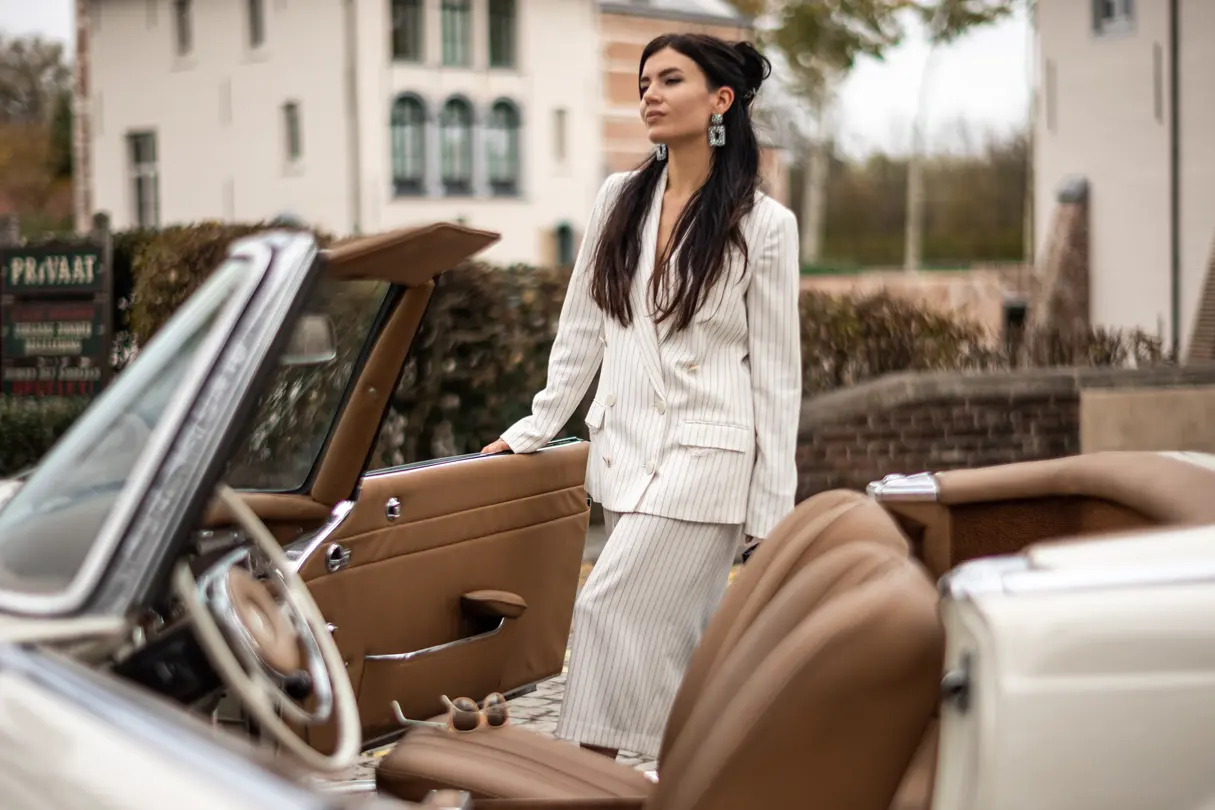Woman with a classic car 