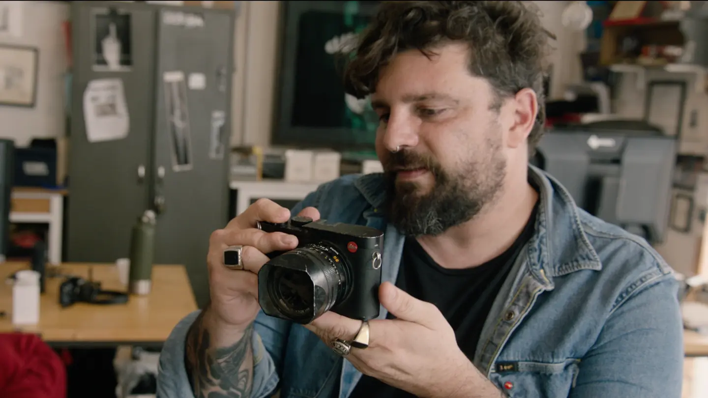 Gabriele Micalizzi showing the camera that saved his life