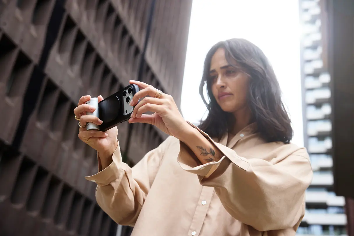 Woman using the Leica LUX Grip, silver