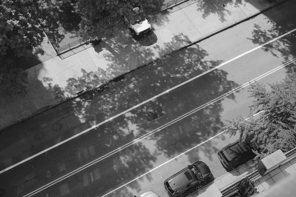 Shadows across a city street.