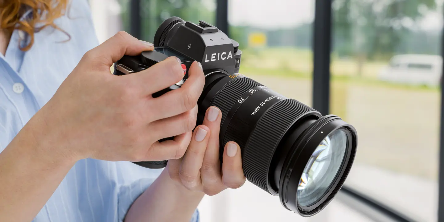 Woman holding a camera in her hands