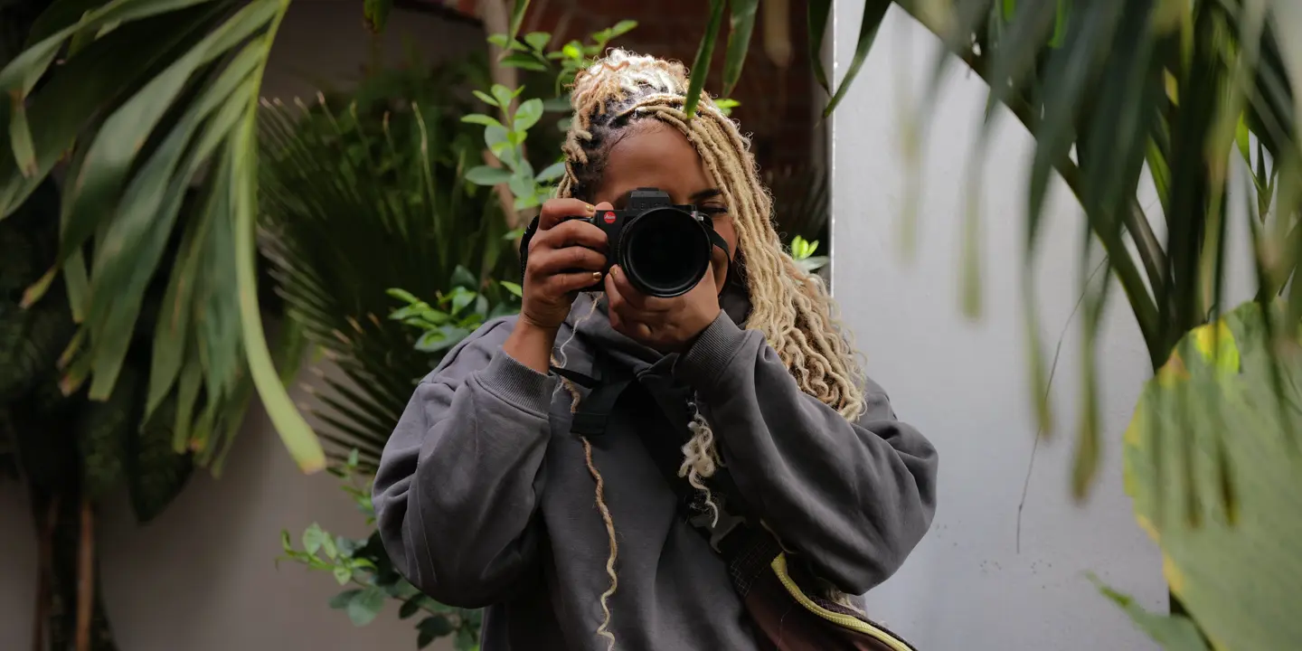 Image of Holly-Marie photographing with the Leica SL3-s