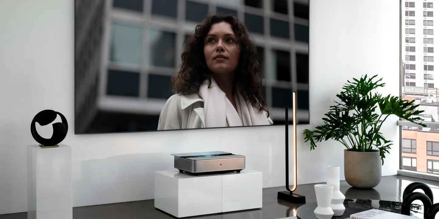 Leica Cine 1 projection on Leica Screen showing a woman in front of a building.