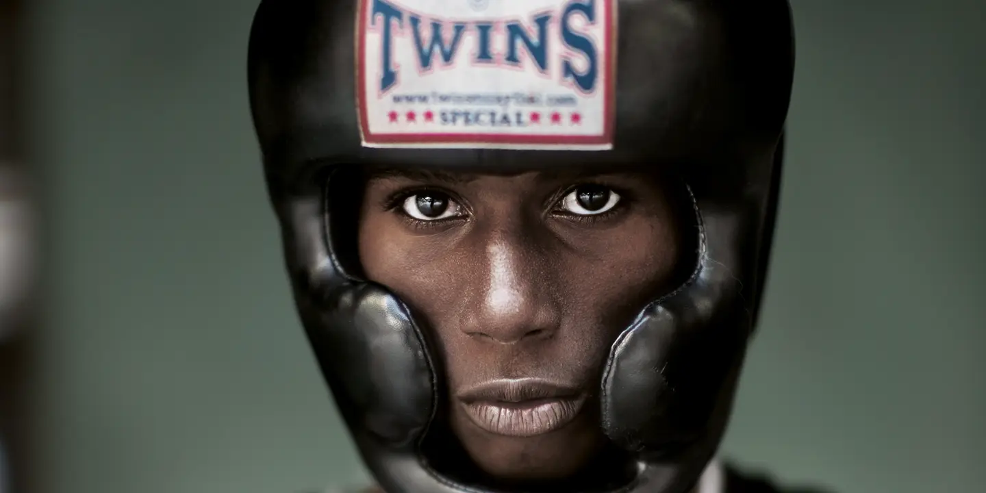 Portrait of a black boxer wearing a boxing helmet