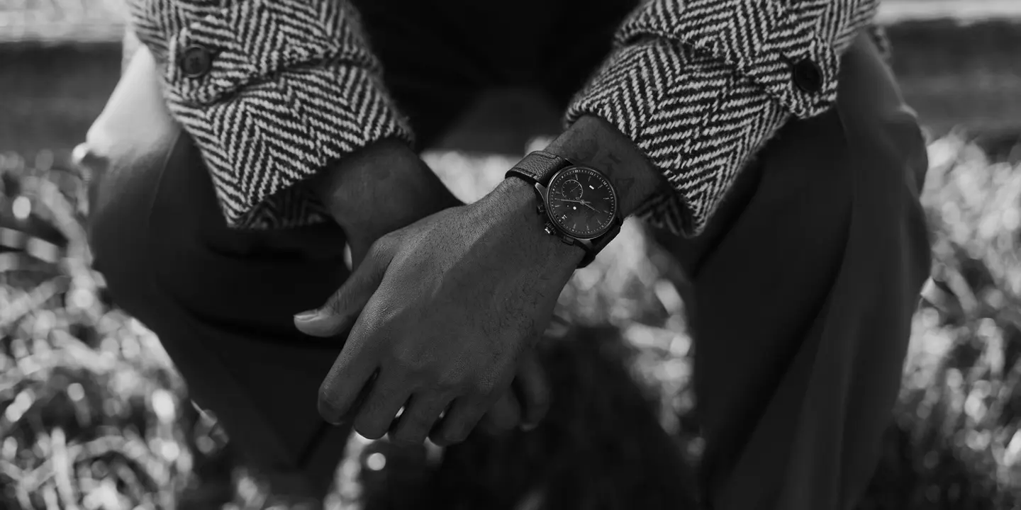 Brandon Ruffin sitting on a bank with his Leica ZM2