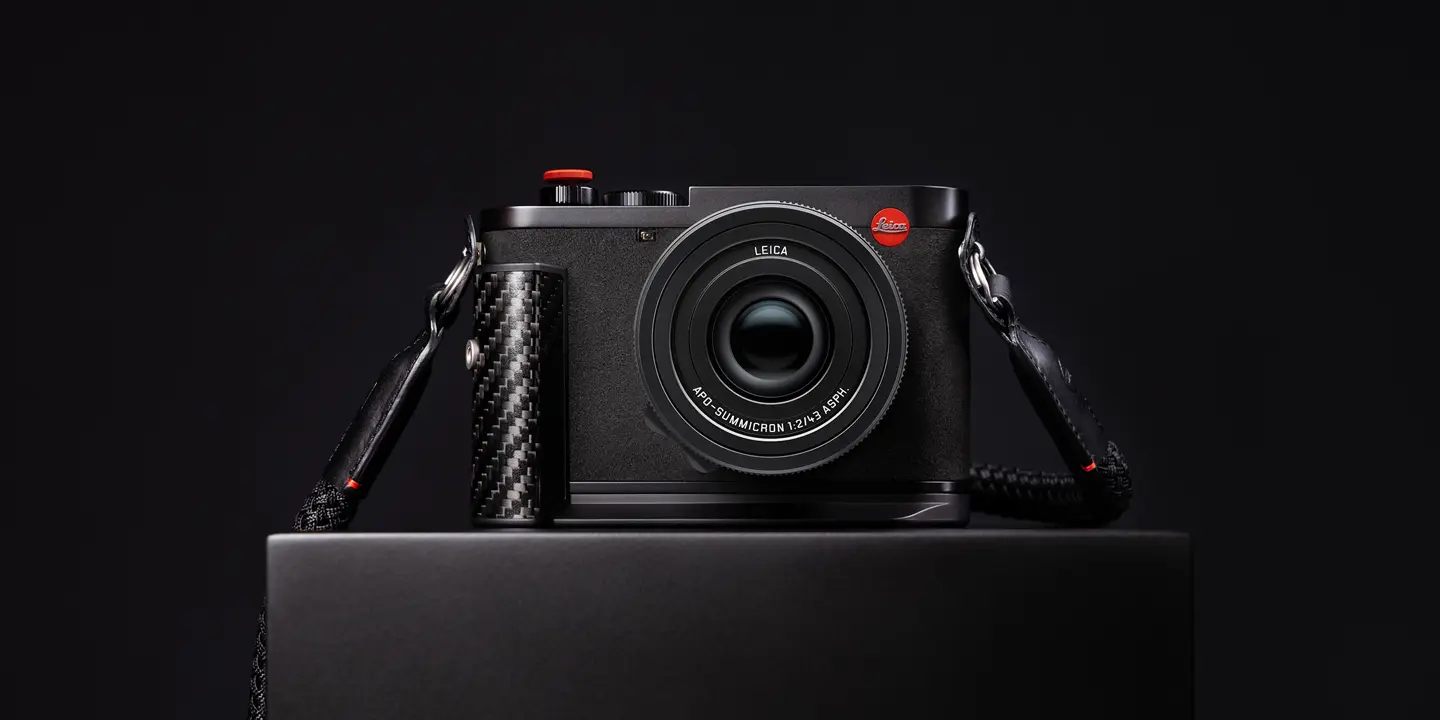 Leica Q3 43 Formula 1® Edition on a table, front view.
