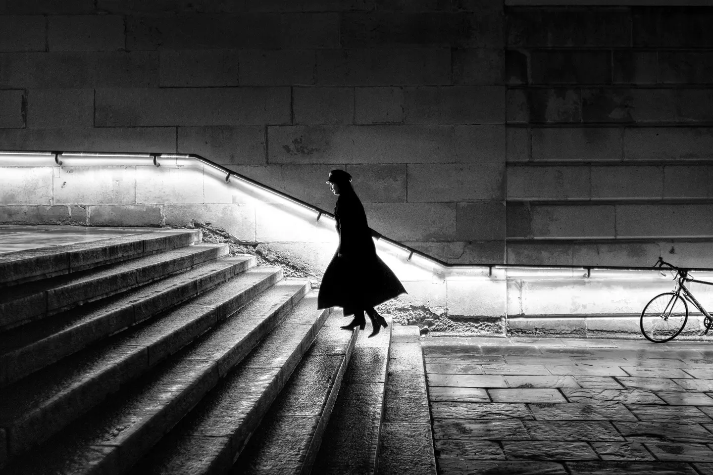 Woman going up stairs.