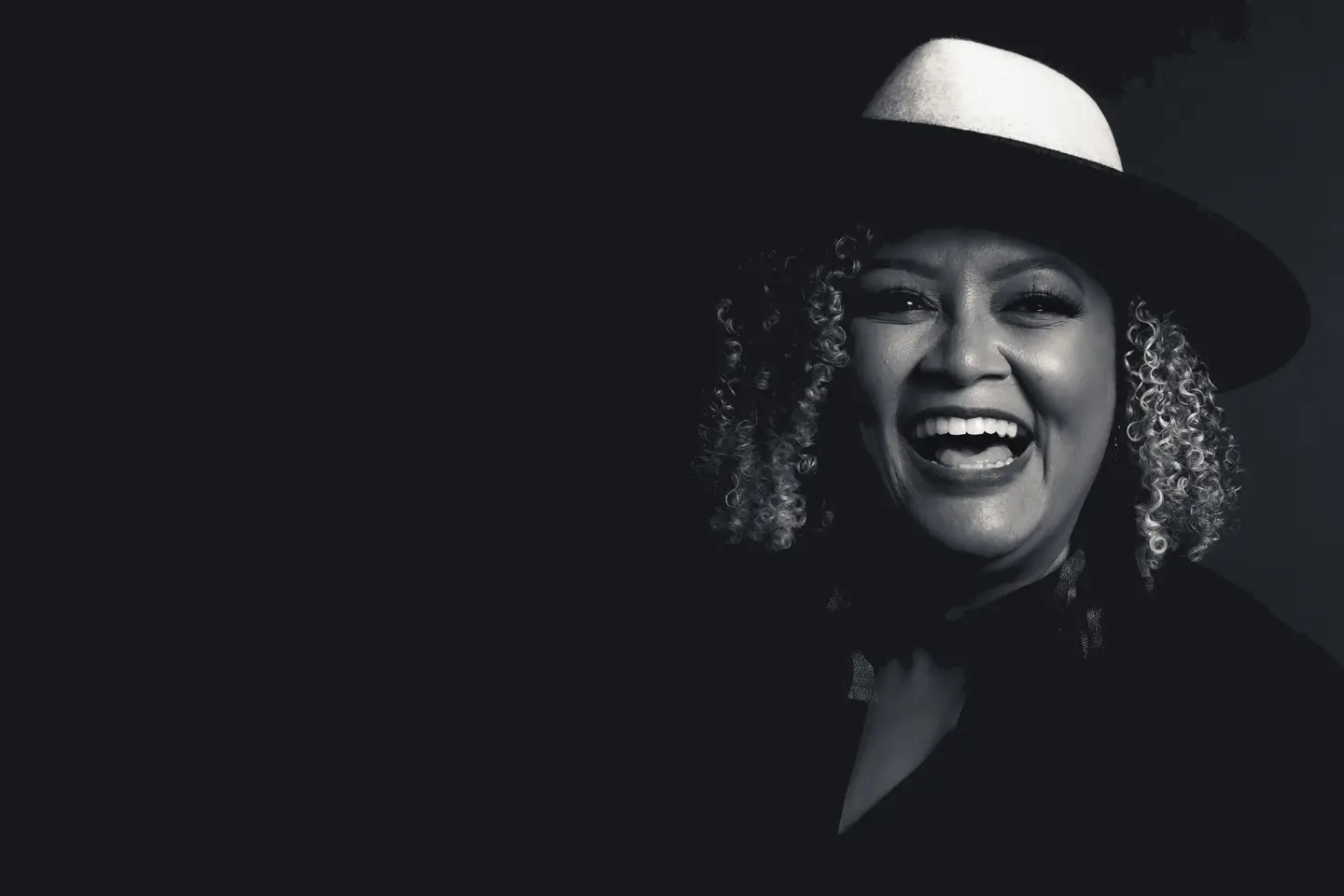 Portrait of a smiling woman wearing a hat