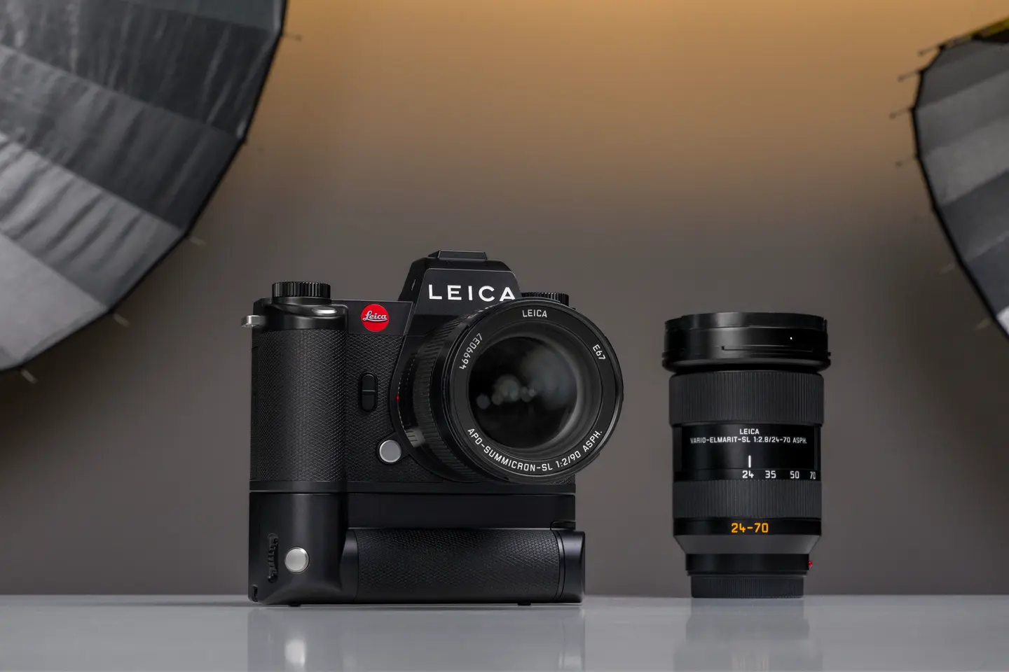 A Leica camera placed on a table in a photography studio setting
