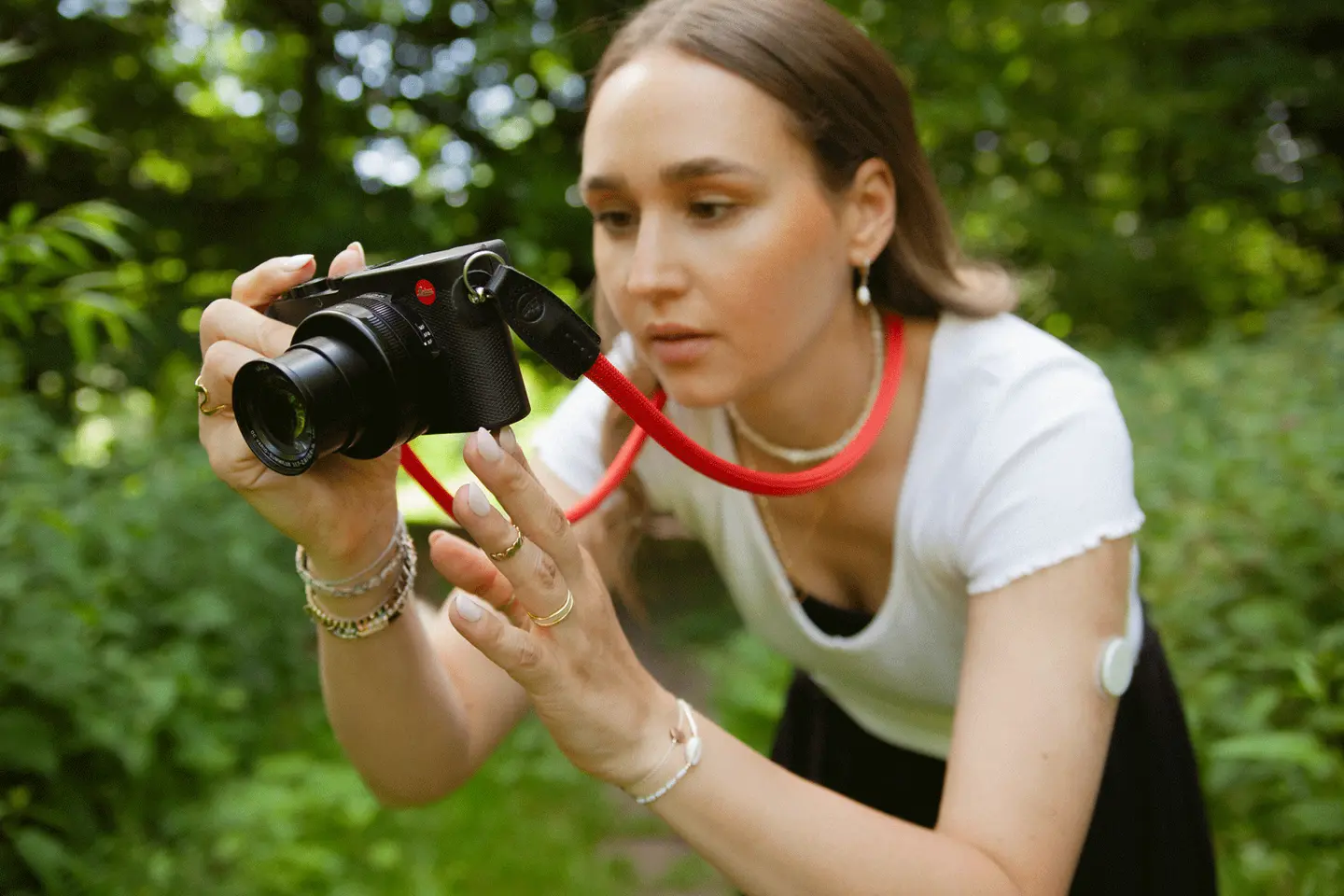 A woman taking a picture in the nature.