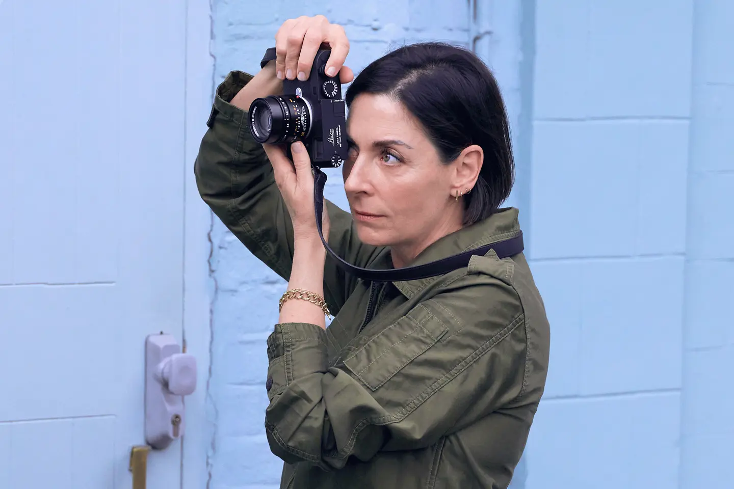 A portrait of Mary McCartney with the Leica M11-P with a Blue background.
