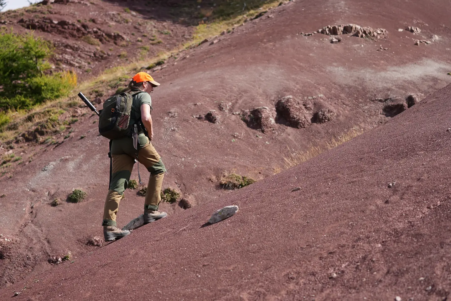 Hunter wlking on a mountain