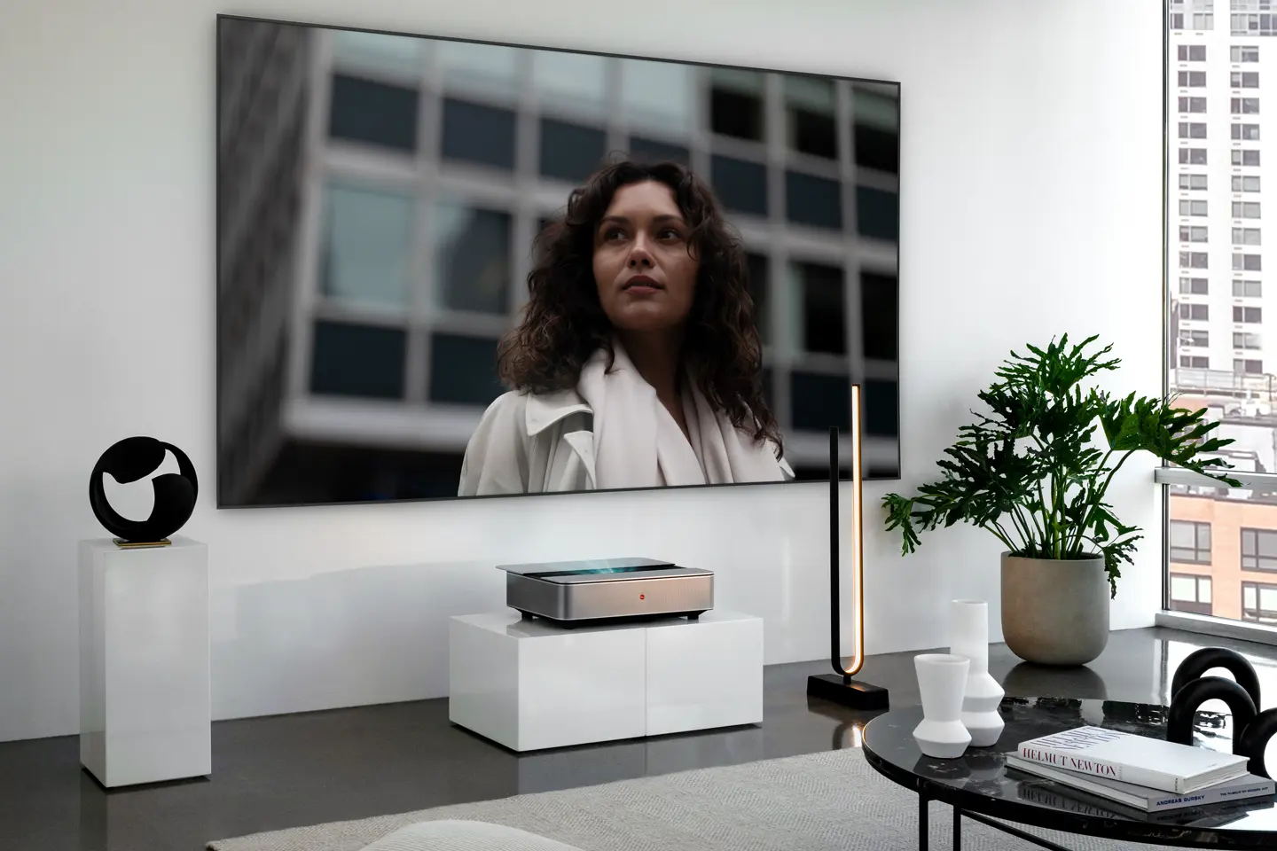 Leica Cine 1 projection on Leica Screen showing a woman in front of a building.