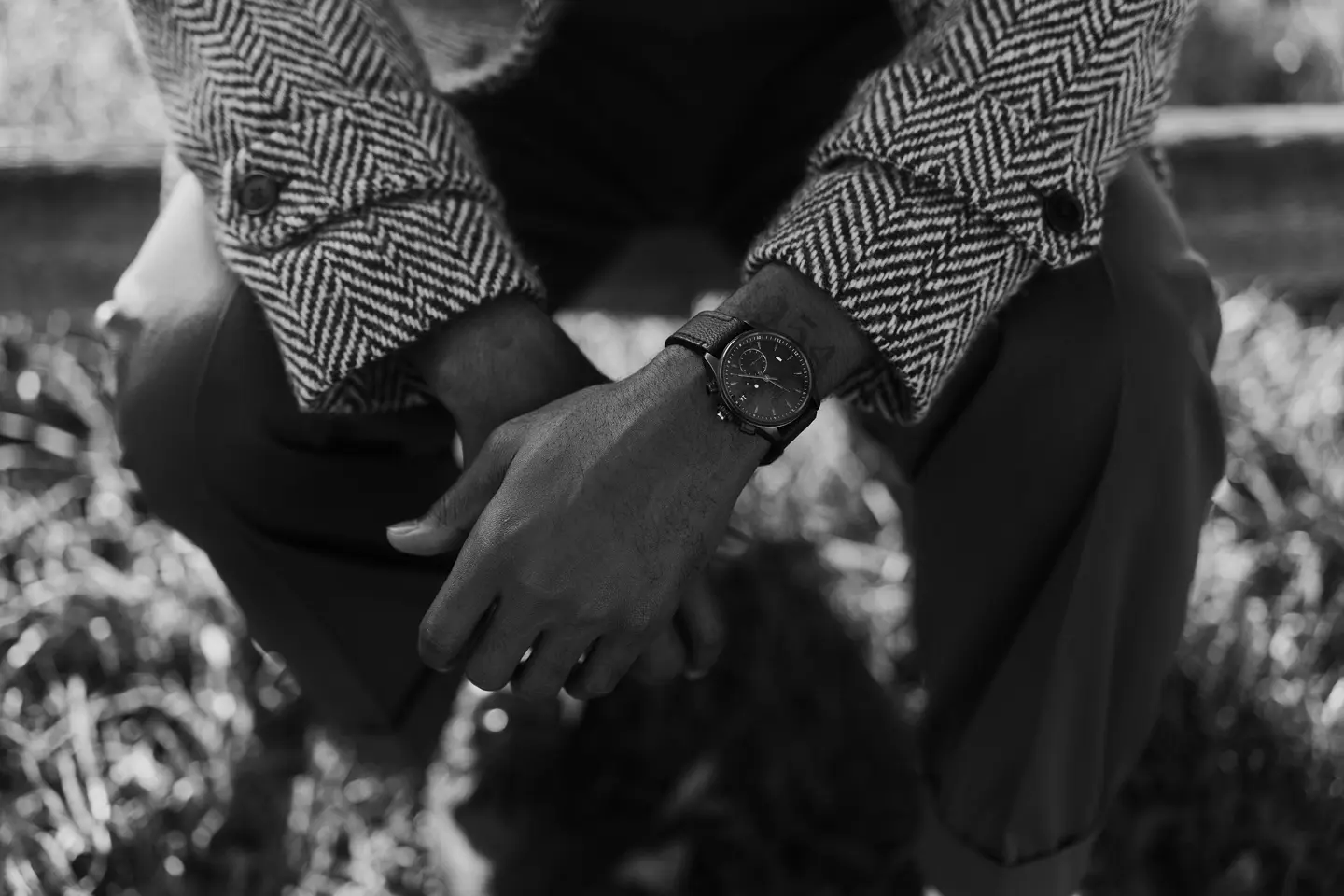 Brandon Ruffin sitting on a bank with his Leica ZM2