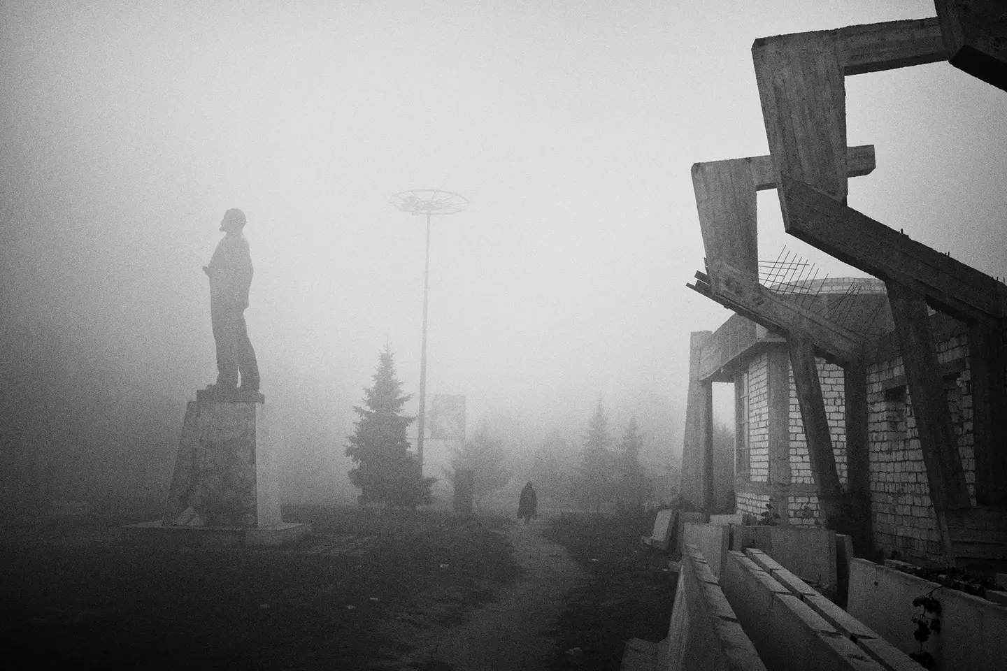 statue in the mist b&w