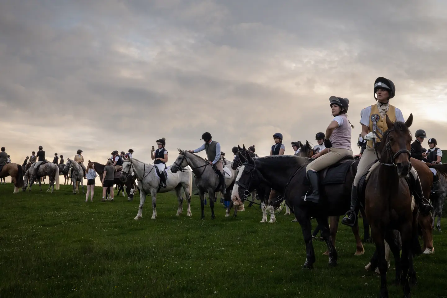 AA lot of riders on a meadow