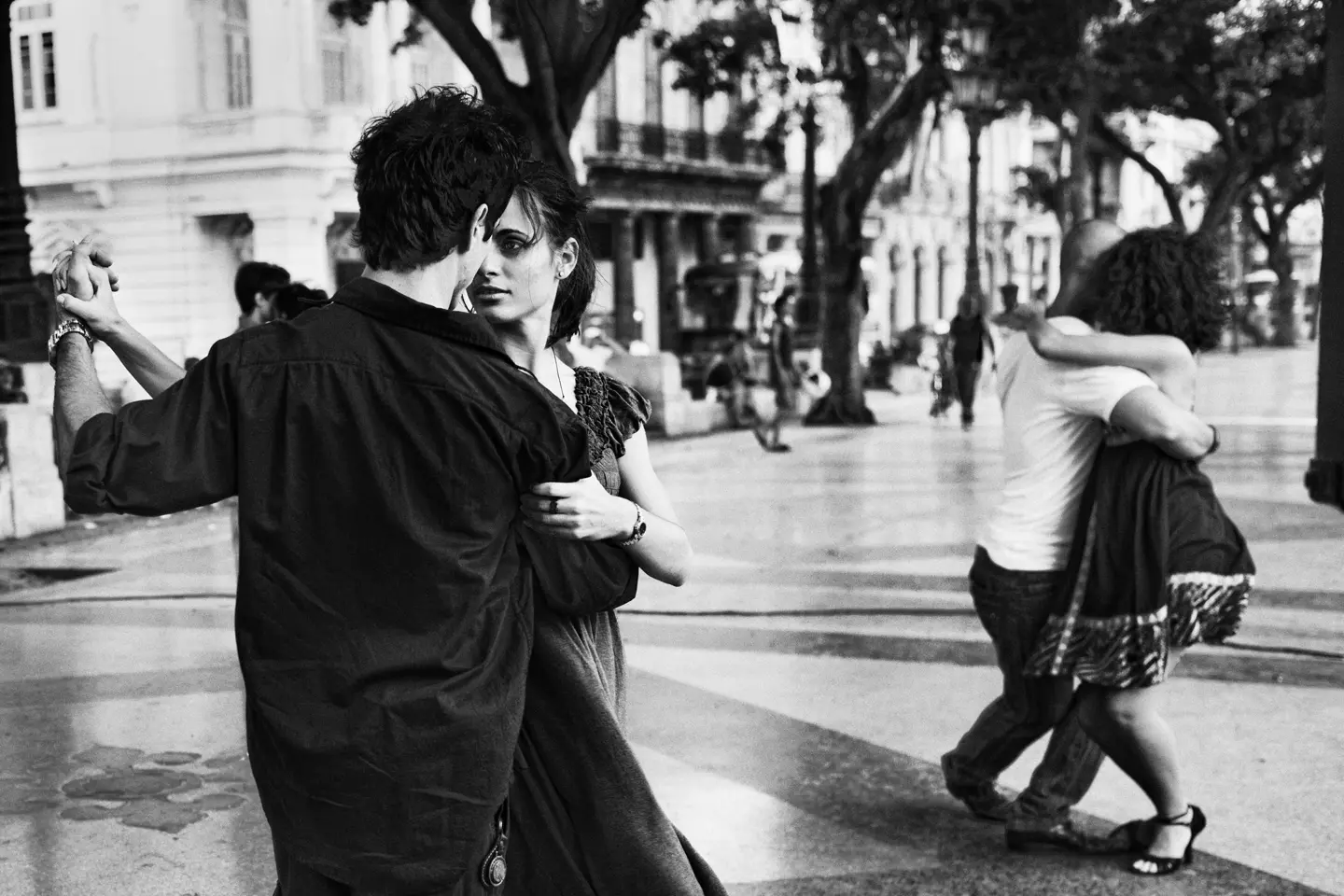 Couples dancing tango on Paseo del Prado in Havana, Cuba, captured in expressive black-and-white street photography.