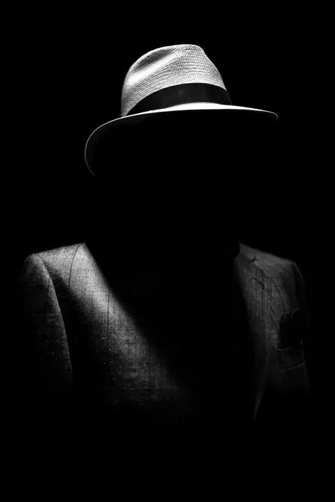 man portrait with hat black and white