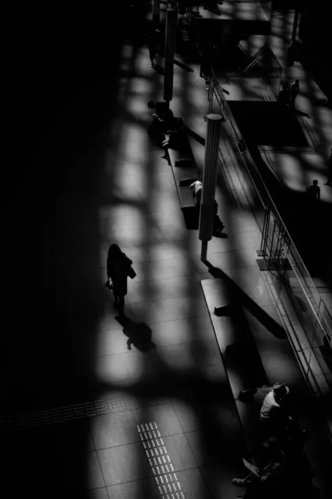 crowd at train stop b&w