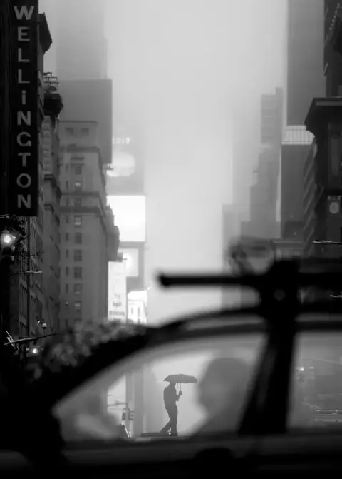 man with umbrella b&w