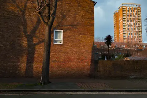 An old house in the foreground and a skyscraper in the background in London