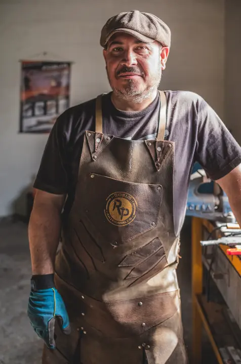 Portrait of an artisan knife maker in his workshop in rural Spain, part of a story about life and craftsmanship in España Vacía.