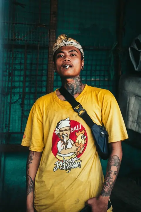A man is standing and smoking