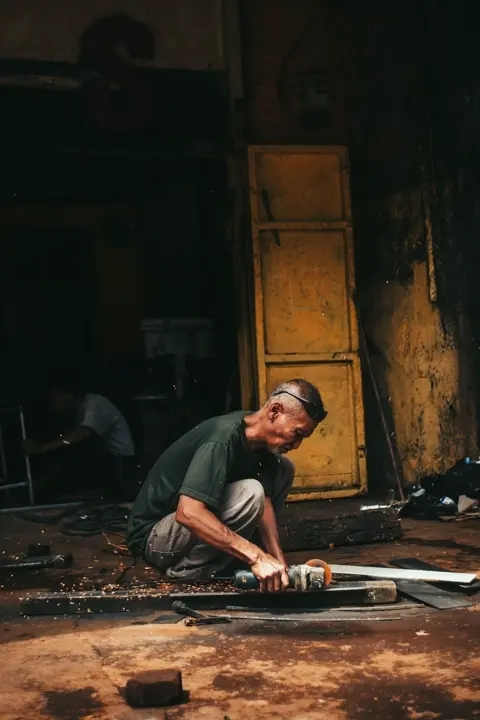A man is sitting and working