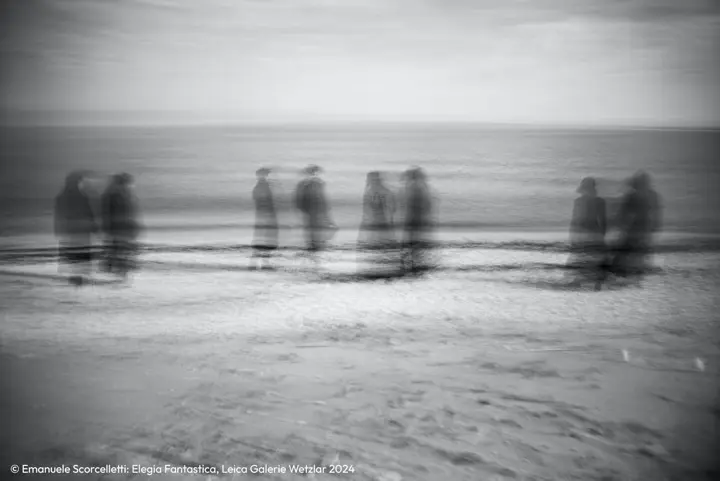 Disappearing scene in black and white with people