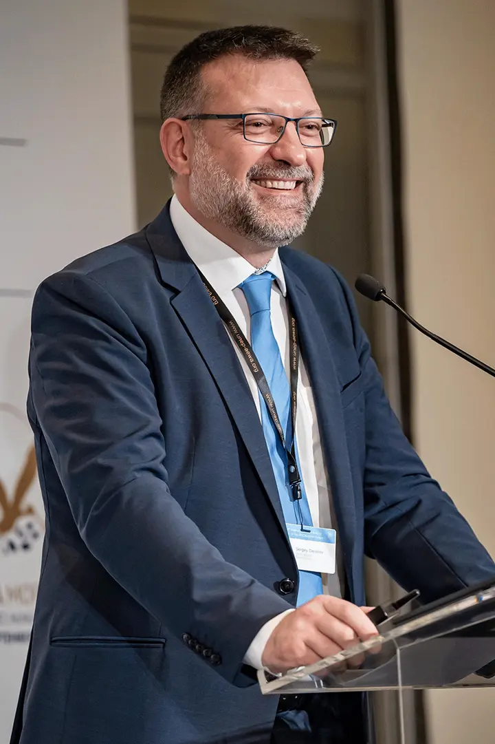 Portrait of Sergey Dereliev at a conference